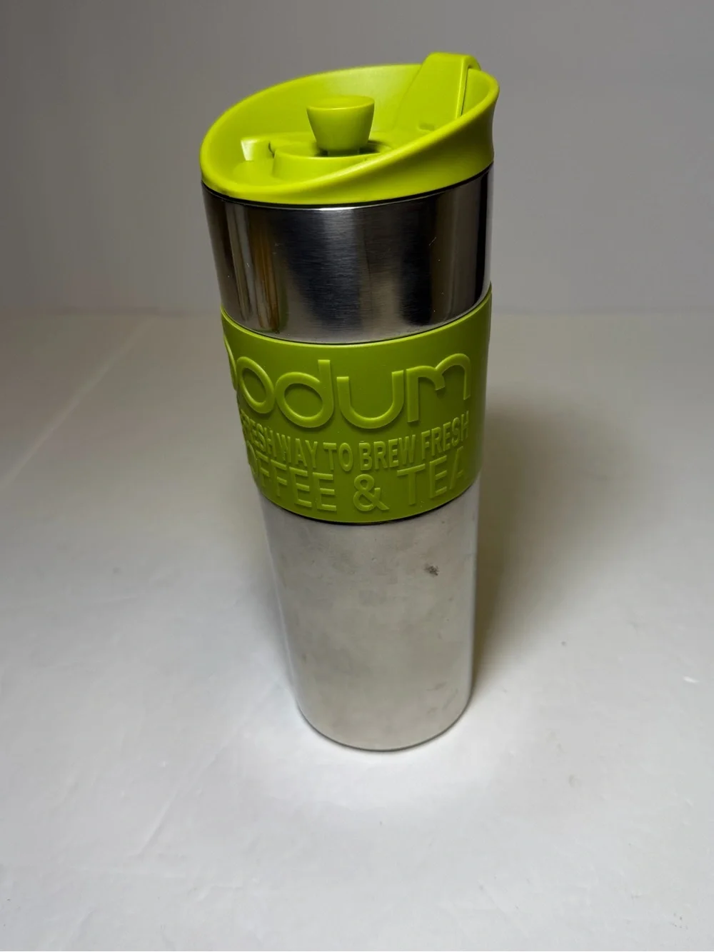 Bodum stainless steel travel French press with green accents coffee tea